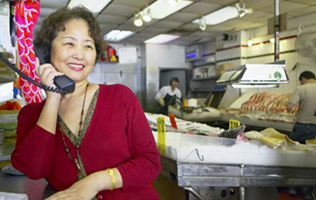 woman on the phone at the dry cleaners